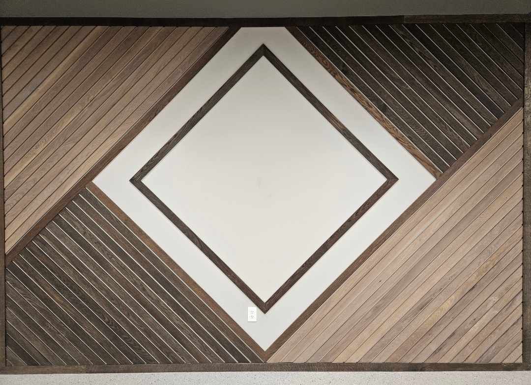 A wall with a diamond-shaped, wooden trim design.